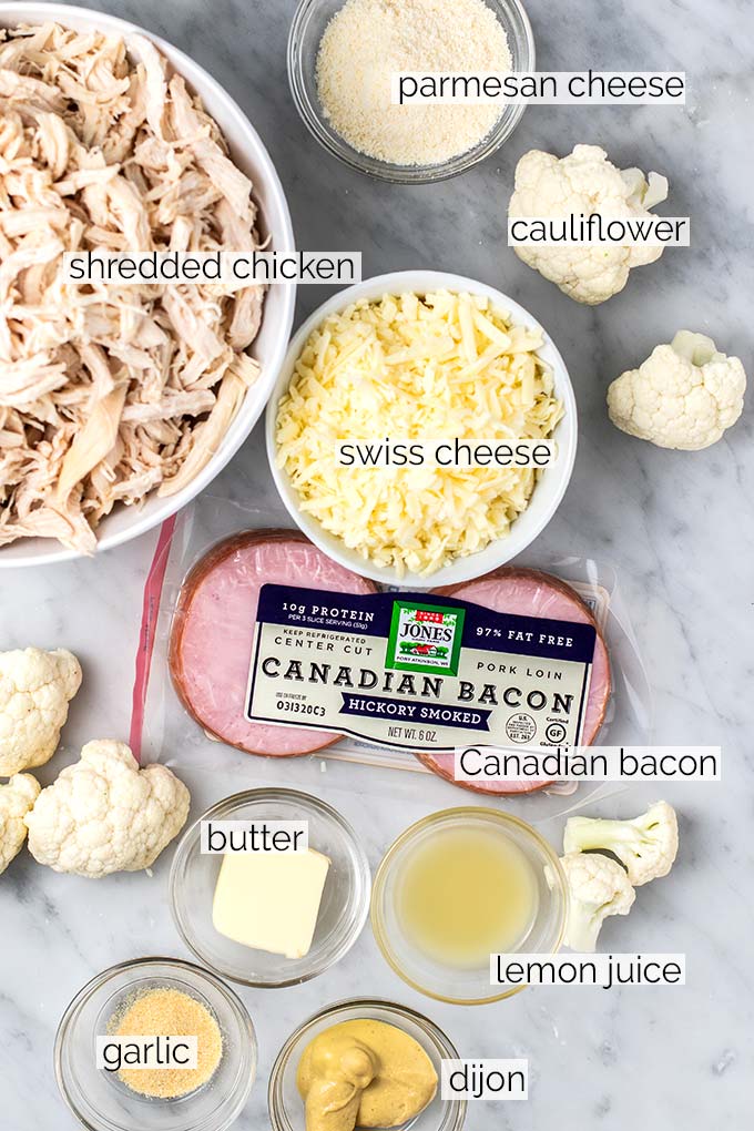 The ingredients for a chicken cordon bleu casserole with a caulifower cheese sauce.