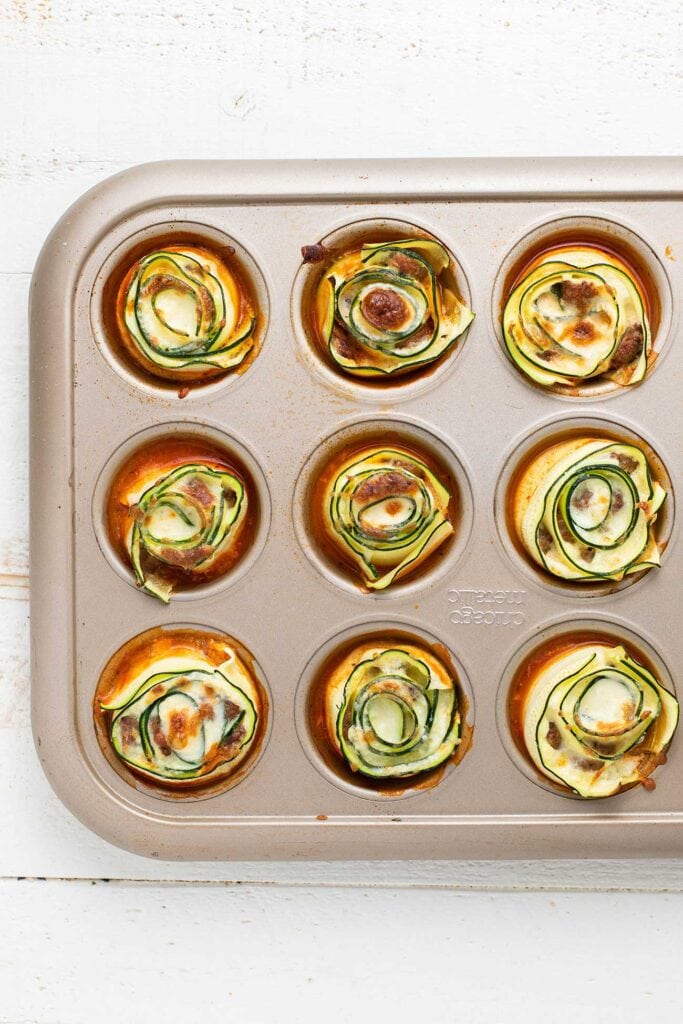 A look at zucchini lasagna rolls baked in a muffin tin.