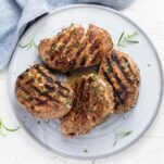 A top down look at 4 grilled pork chops marinated in a balsamic dijon mixture.