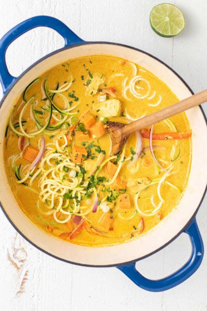 A large pot filled with a Thai Red Curry Soup.