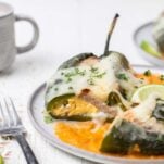 A close up look at a breakfast chile relleno stuffed with eggs, cheese, and sausage.