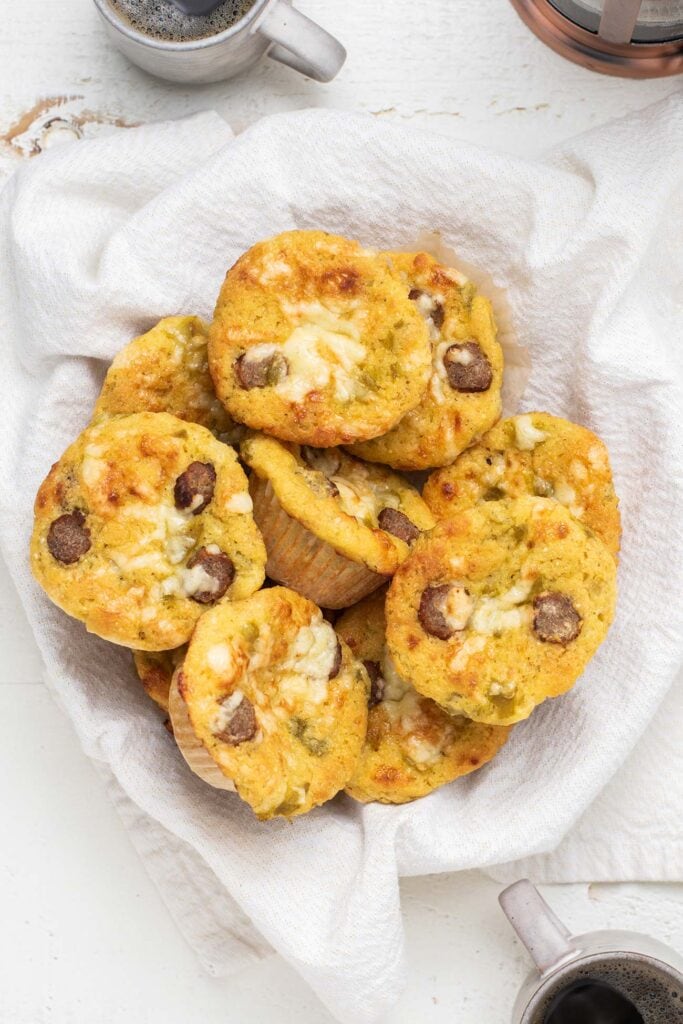 Cornbread muffins arranged in a basket.