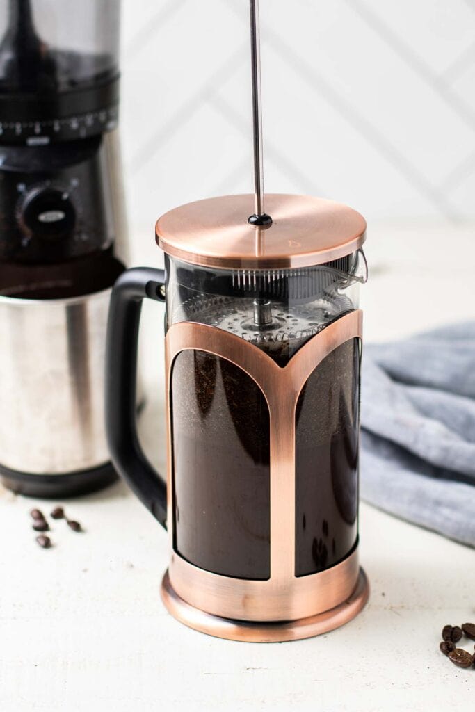 A french press shown brewing cold brew coffee.