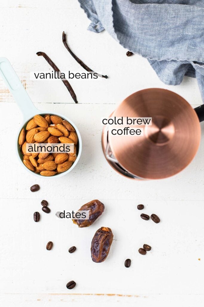 The ingredients needed to make an iced almond milk latte.