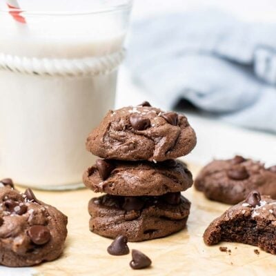 A stack of 3 flourless chocolate cookies .