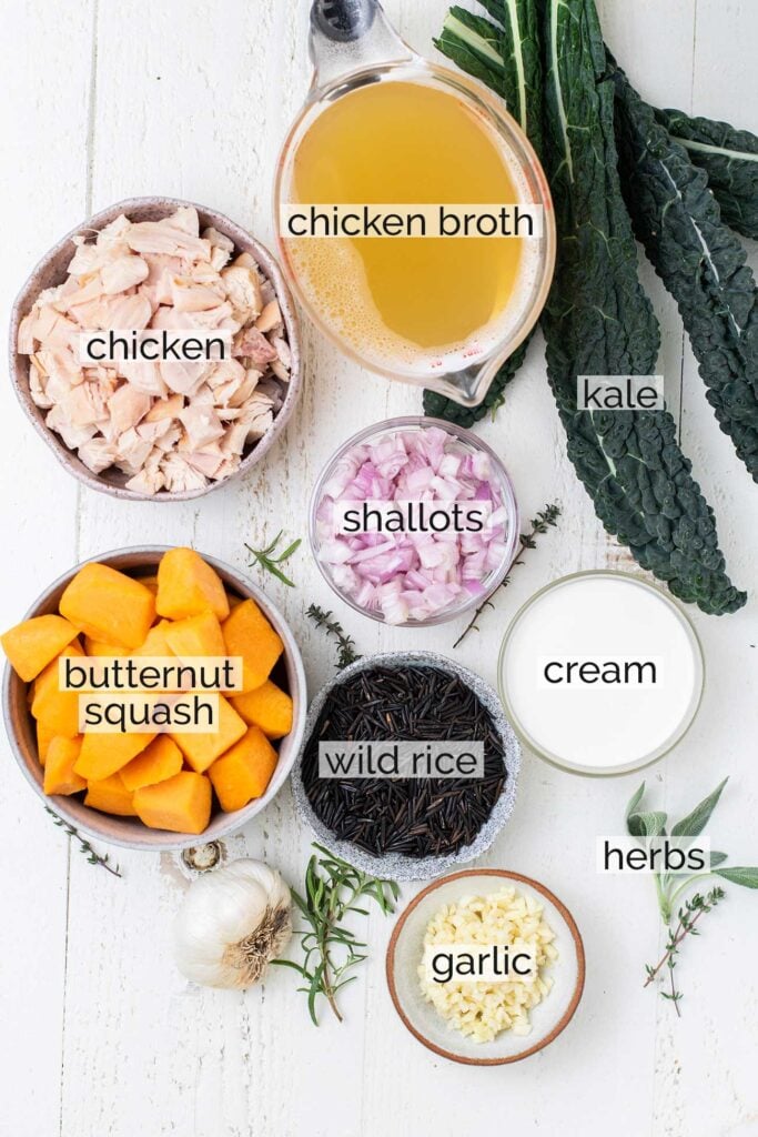 The ingredients needed to make a creamy chicken and wild rice soup.