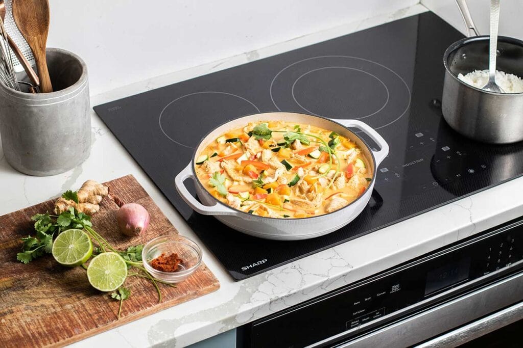 A curry shown simmering on a Sharp Induction cooktop.