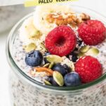 A close up look at whole30 chia pudding topped with fruit and nuts.