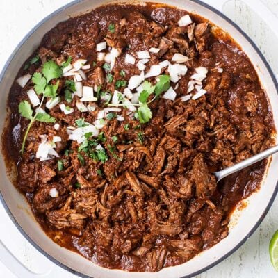 A pan filled with Birria de Res, a Mexican beef stew.