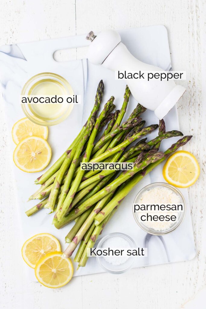 The ingredients needed to make asparagus in an air fryer shown with labels.
