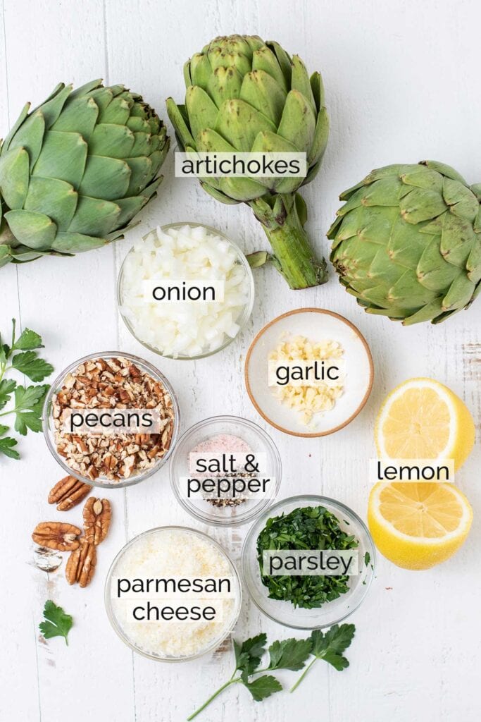 The ingredients needed to make stuffed artichokes.
