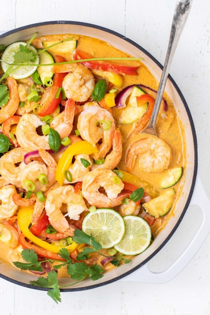 A large skillet with a Thai Red Curry with Shrimp and Vegetables.