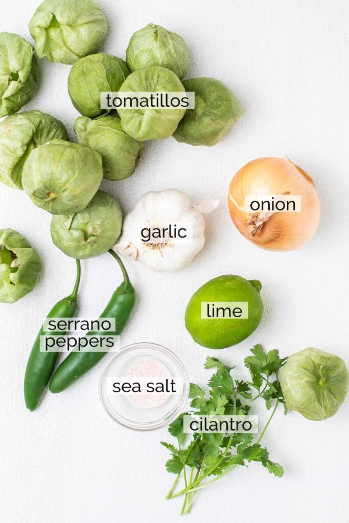 The ingredients needed to make a roasted tomatillo salsa.