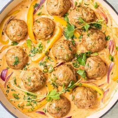 A close up look at a Thai red curry with turkey meatballs.
