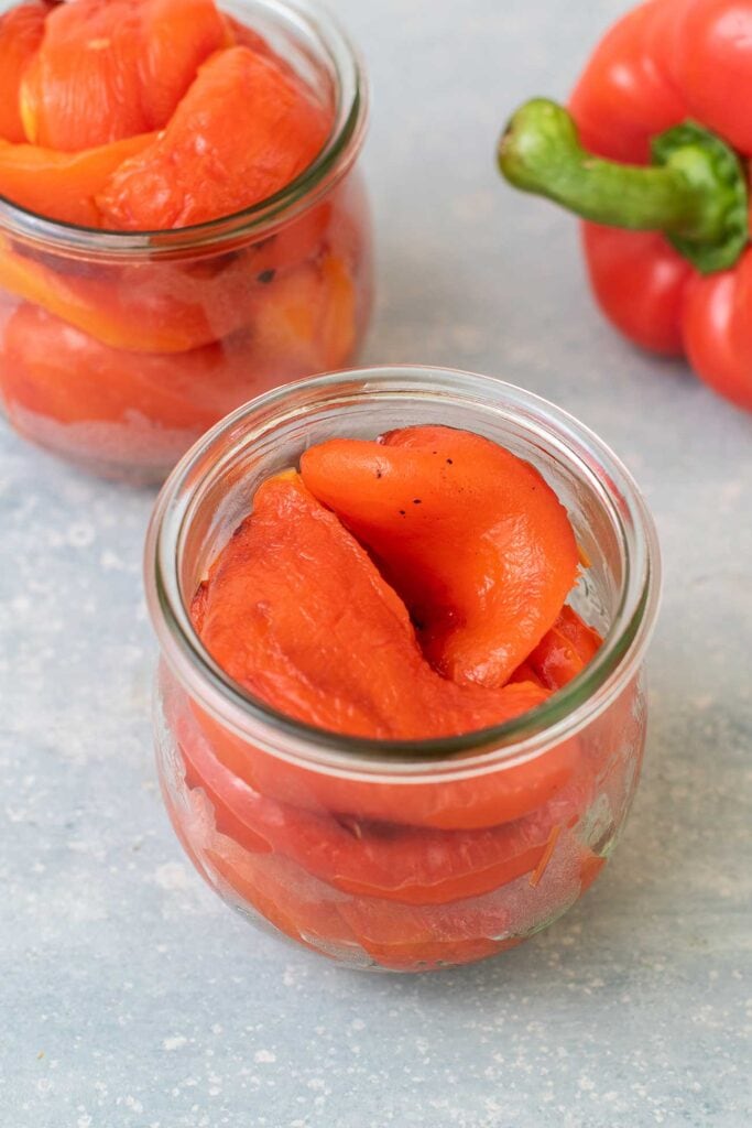 Jars filled with homemade roasted red peppers.