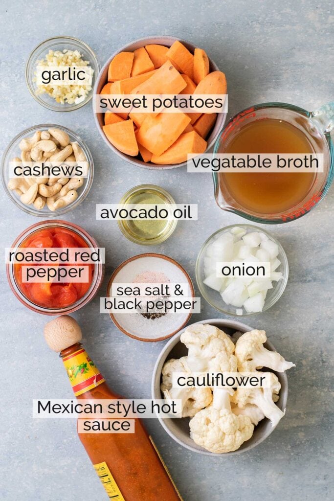 The ingredients needed to make a sweet potato soup with roasted red peppers.