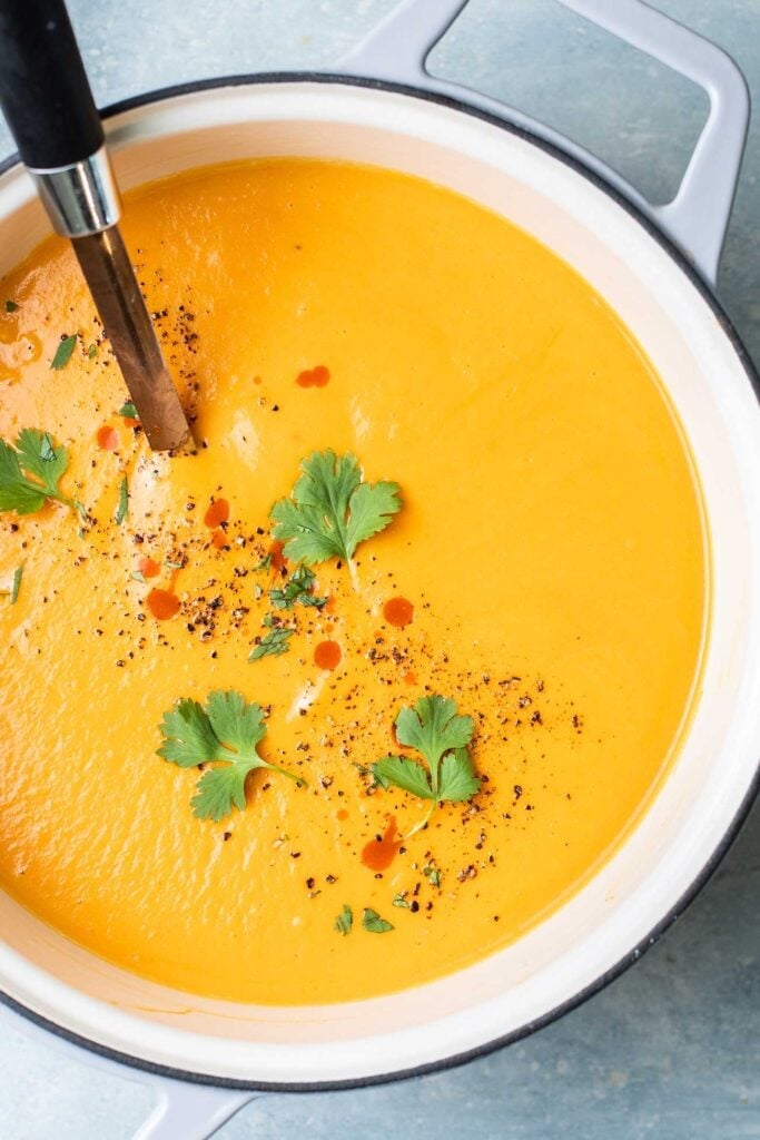 A large pot filled with sweet potato soup.