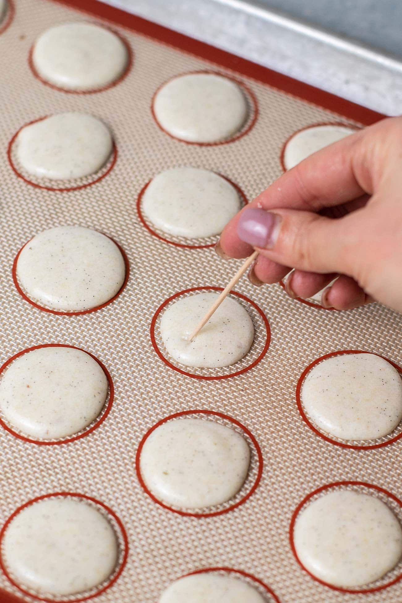 Popping air bubbles in the cookies.