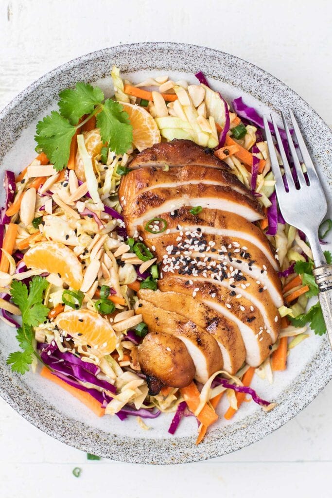 A healthy Chinese Chicken Salad made with cabbage, oranges, and almonds.