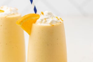 Orange Julius smoothie topped with whipped cream.