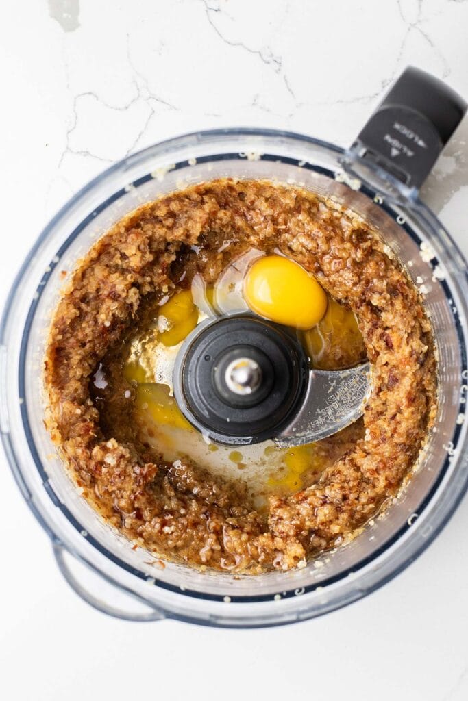 An egg and coconut oil added to the date and quinoa mixture.