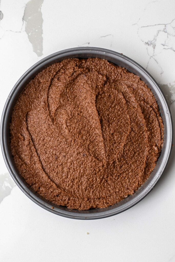 The quinoa cake batter spread into the cake pan.