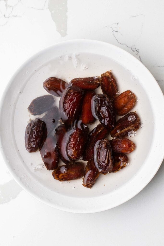 Medjool dates soaking in water.