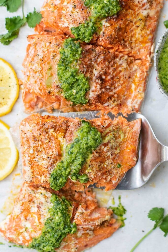 A slow roasted salmon topped with Mojo Verde, a Spanish green herb sauce.