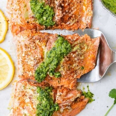 A slow roasted salmon drizzled with a green herb sauce.