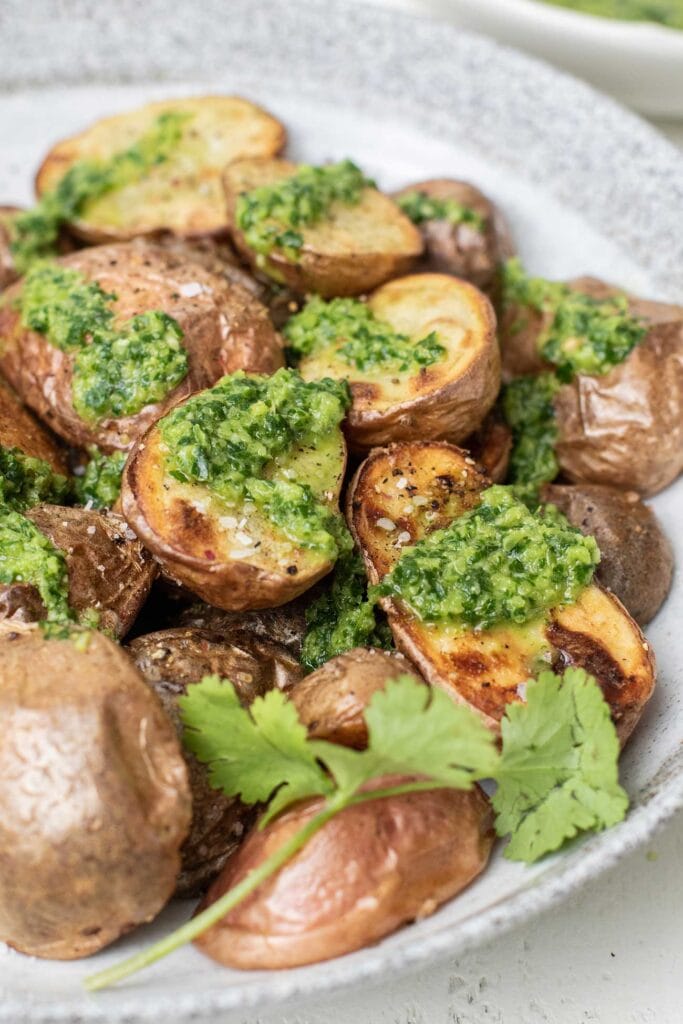 Roasted potatoes covered in mojo verde.
