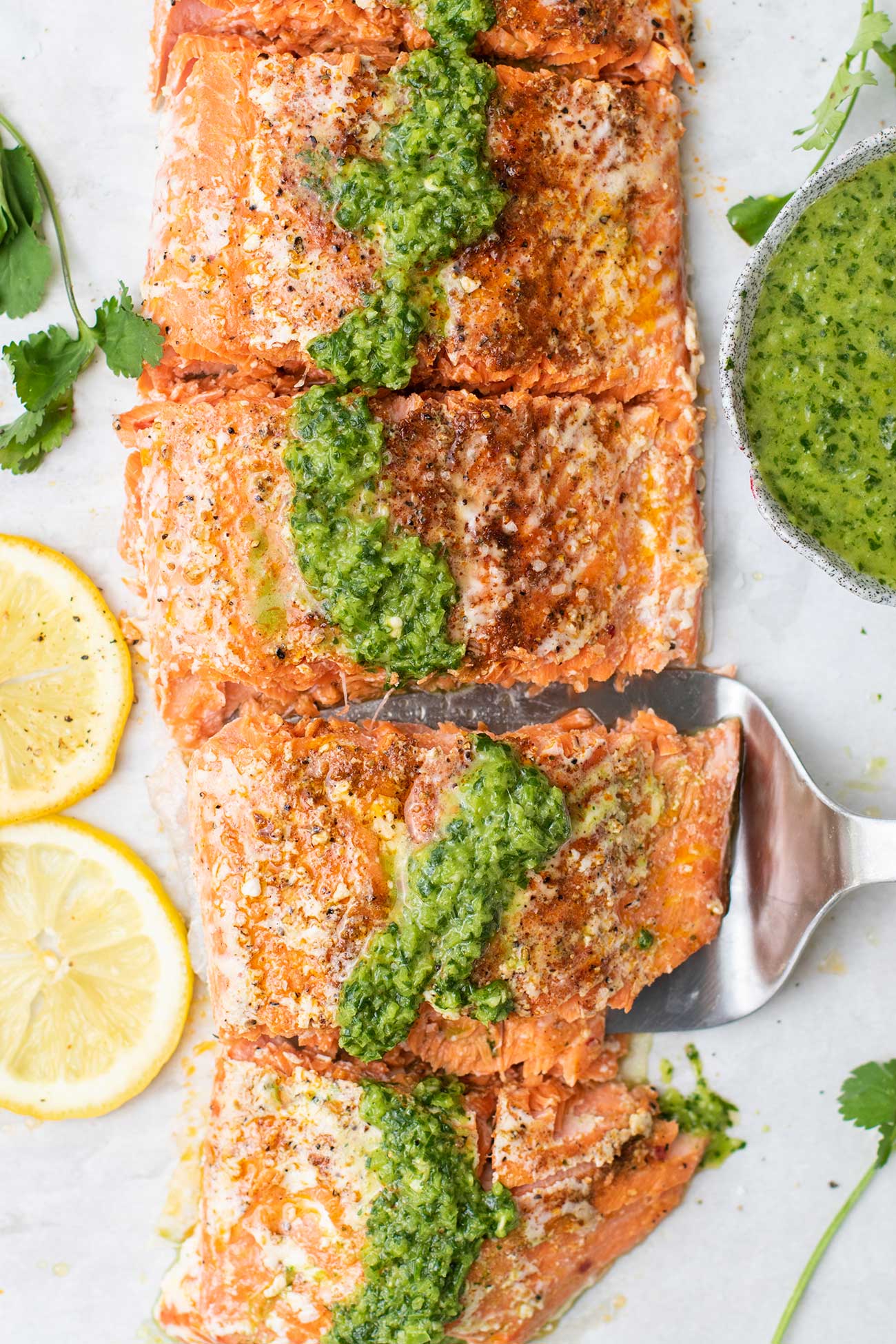 Salmon shown drizzled with mojo verde.