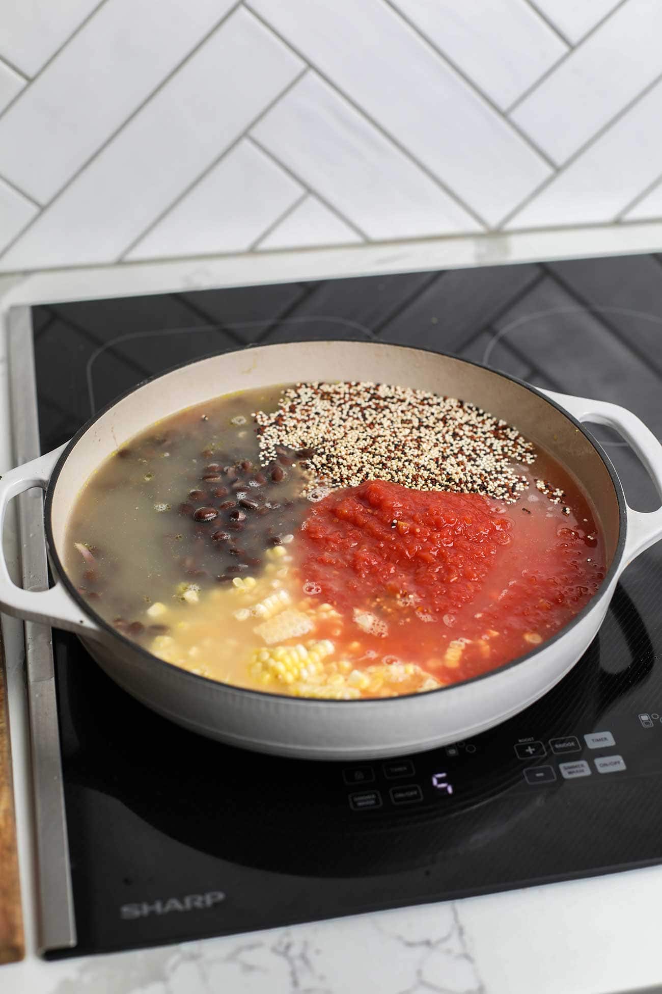 Step 2 shows adding all the mexican quinoa ingredients to a dutch oven and heating to a boil.