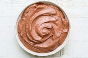 A thick textured smoothie in a bowl.