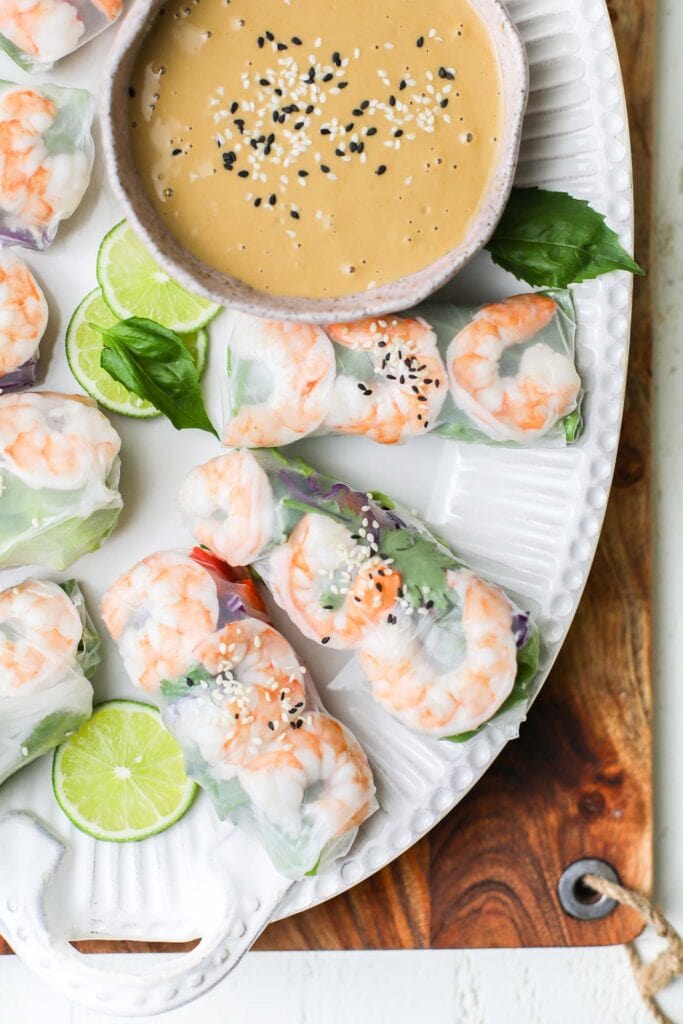 Vietnamese spring rolls showns with a peanut dipping sauce.