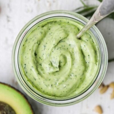 A vibrant green salad dressing made from avocados and herbs.