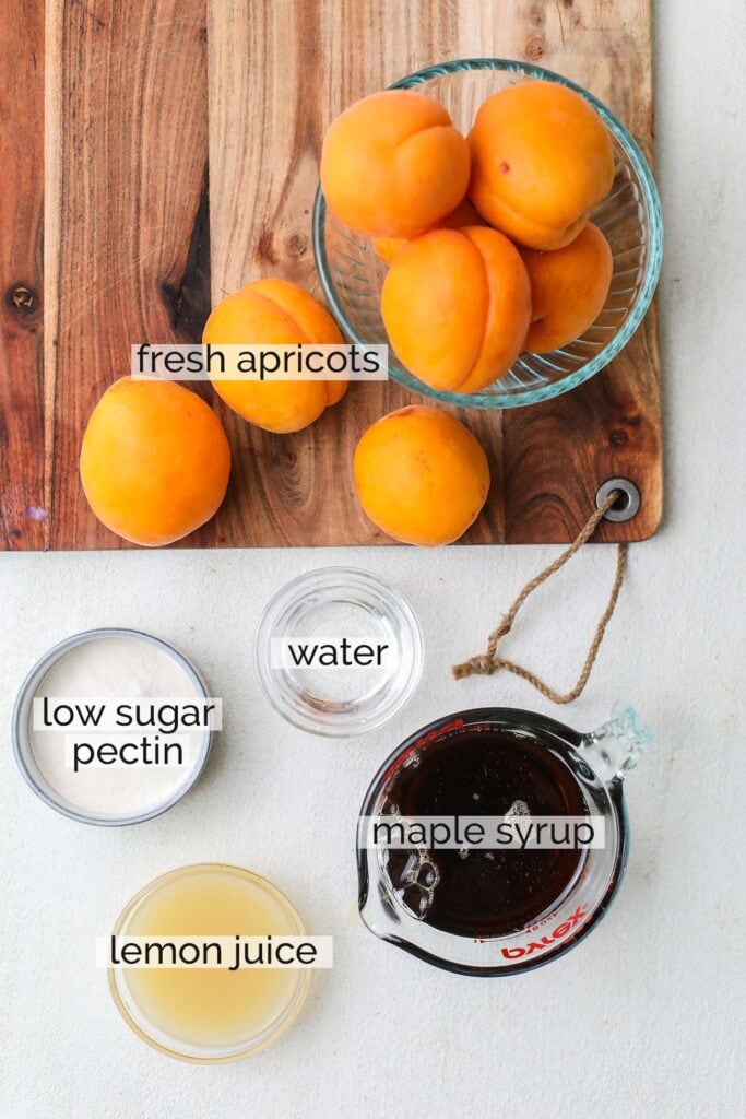 The ingredients needed to make apricot jam.