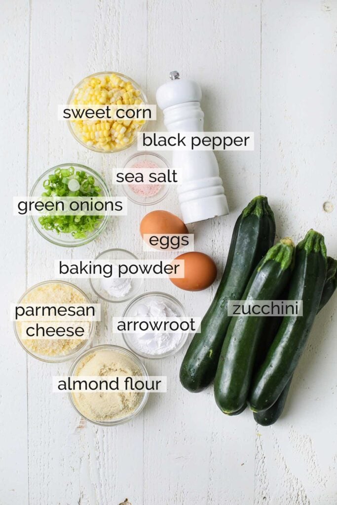 The ingredients needed to make zucchini and corn fritters.