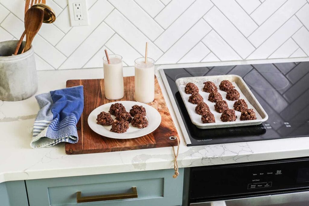No bake cookies sitting on a cutting board next to the Sharp Induction Cooktop.