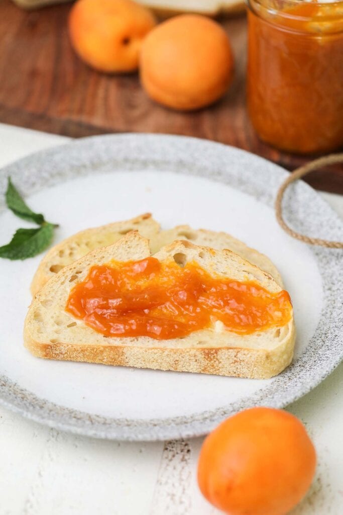 Bread spread with a thick layer of low sugar apricot jam.