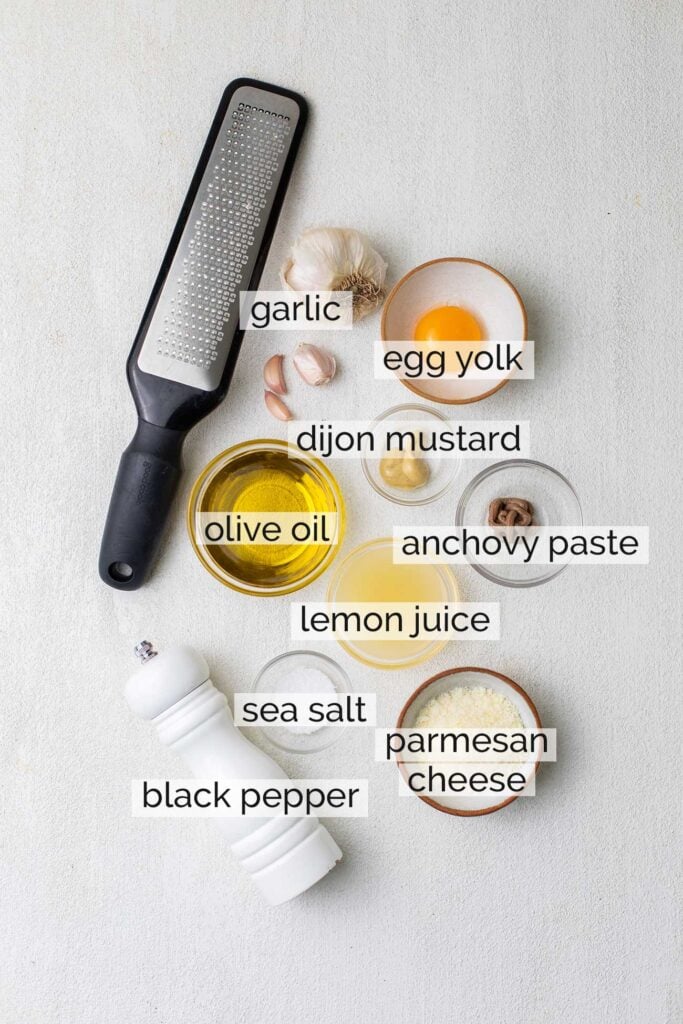 The ingredients needed for a homemade caesar dressing.