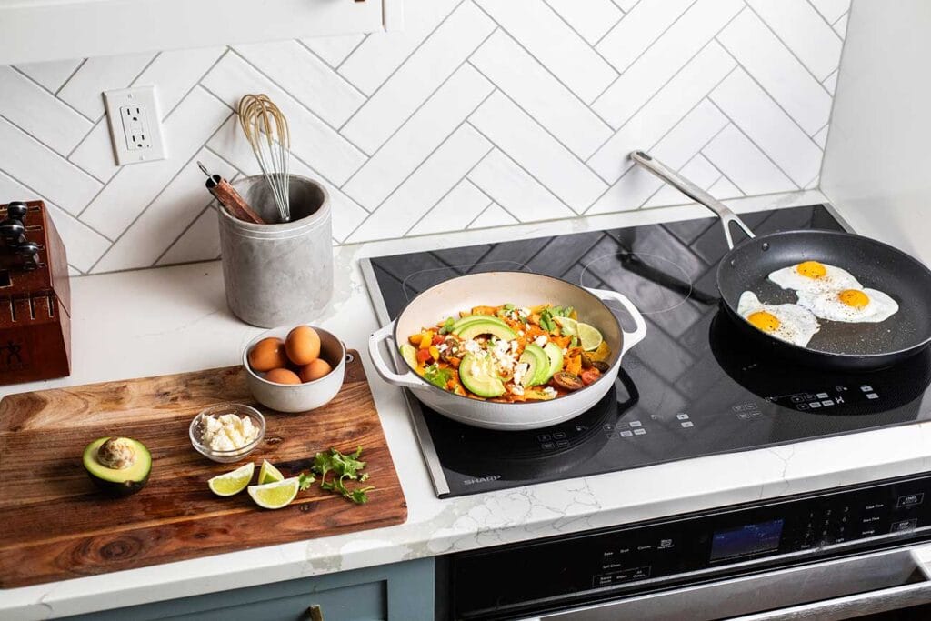 The Sharp induction cooktop with Chilaquiles and fried eggs cooking on it.
