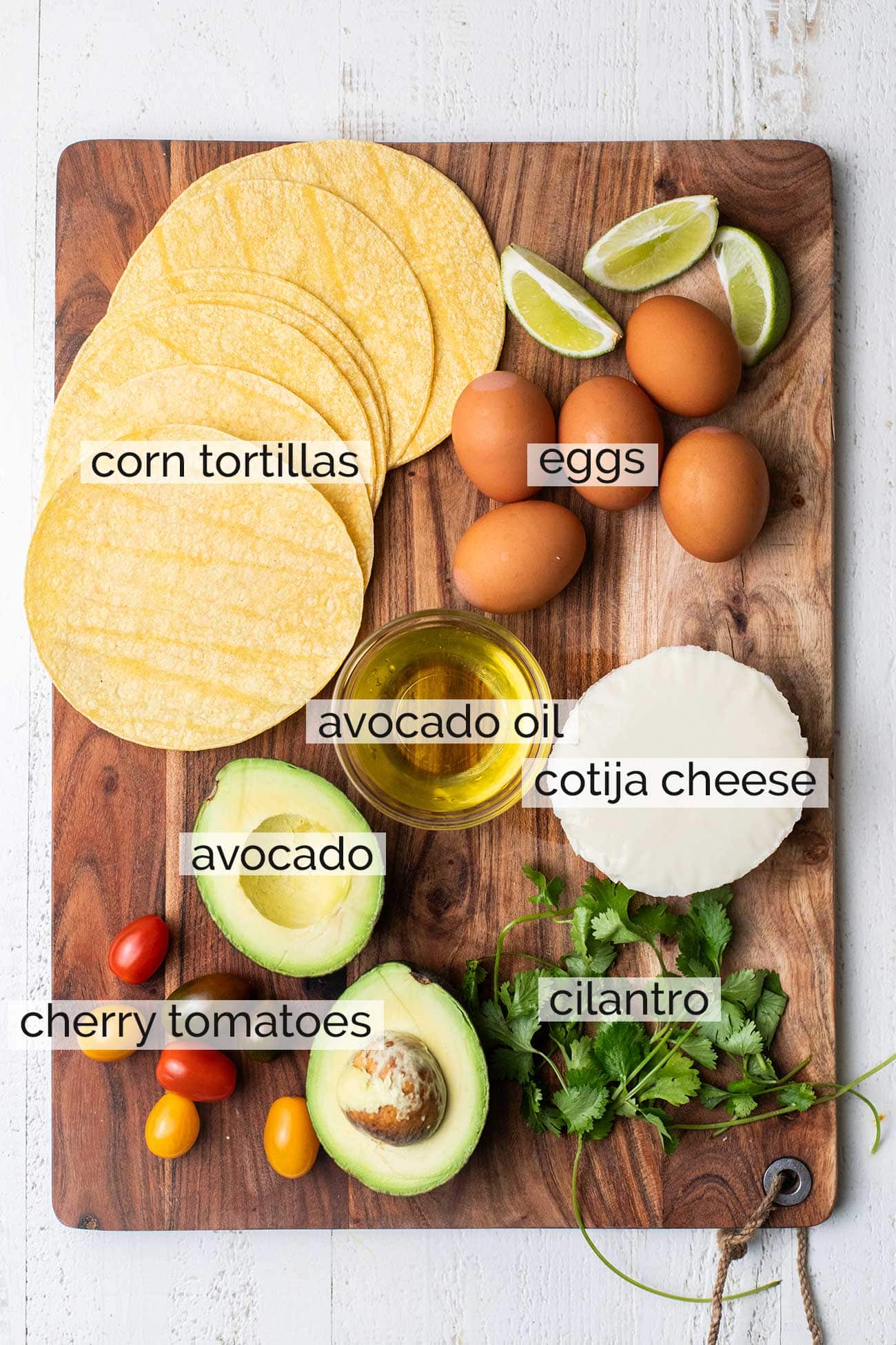 The ingredients to make chilaquiles rojos topped with fried eggs.