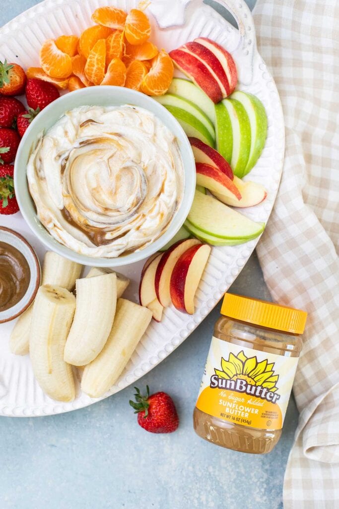 A platter of fruit served with SunButter Caramel yogurt fruit dip.