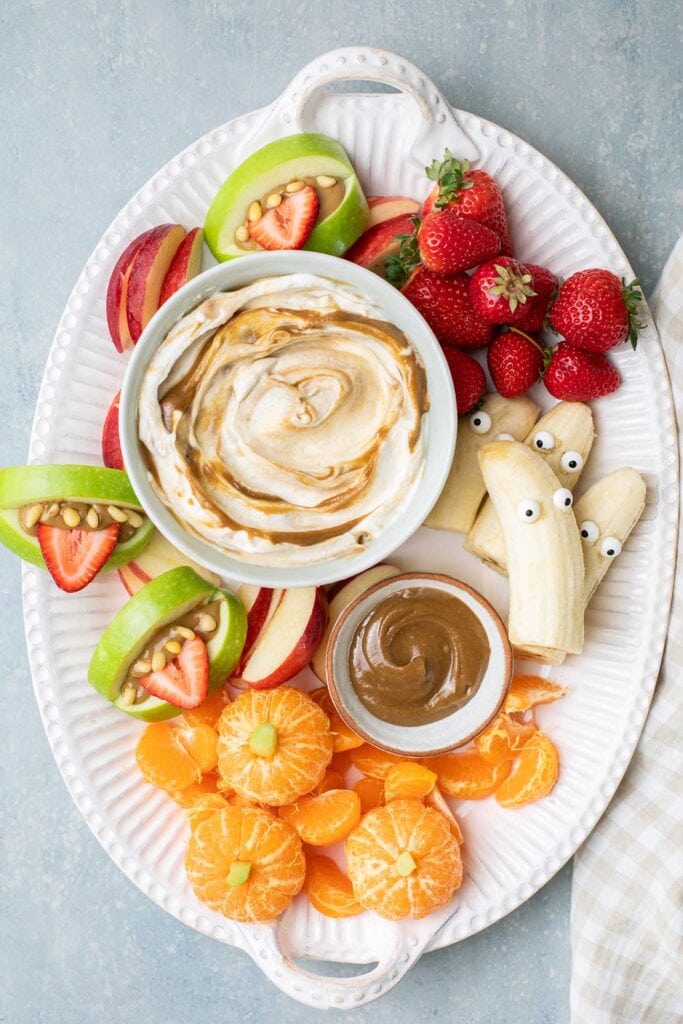 A Halloween fruit platter served with a yogurt fruit dip.