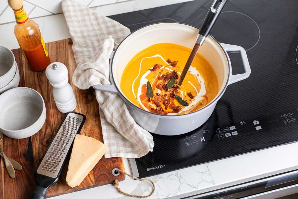 The Sharp induction cooktop shown with a pot of butternut soup.