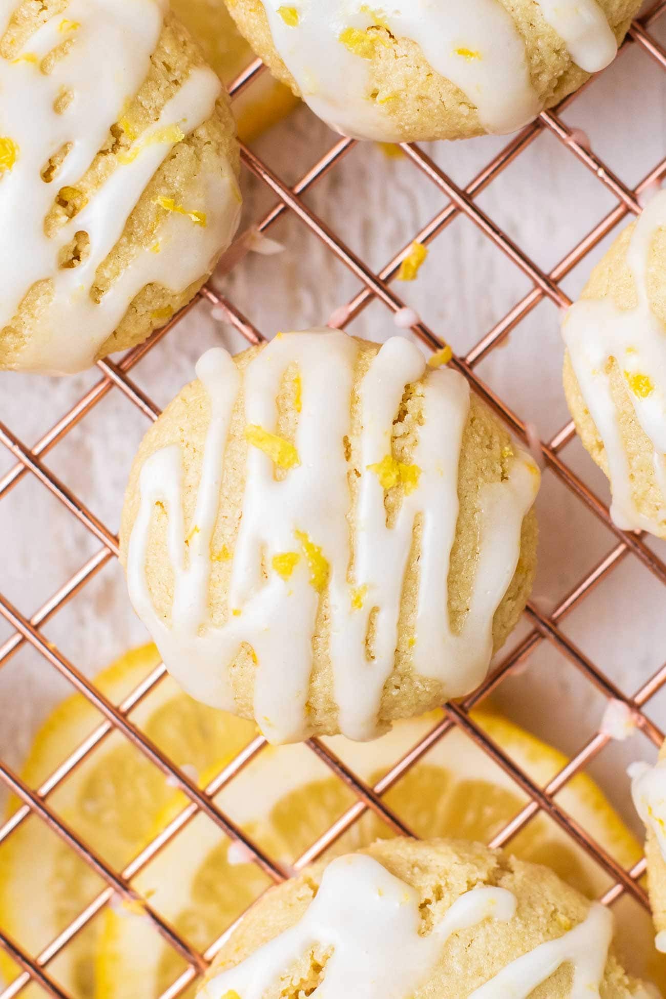 A close up look at a lemon cookie drizzled with a lemon glaze.