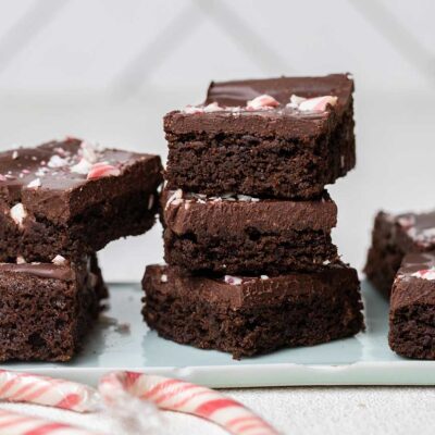 A stack of 3 peppermint brownies with a thick fudge layer.