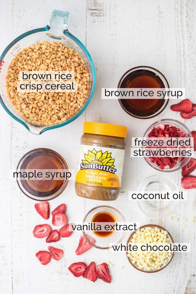 The ingredients needed to make strawberry rice crispy treats shown with labels.