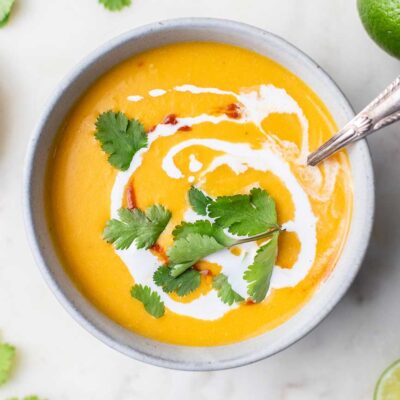 A close up look at a bowl of Thai red curry butternut soup.