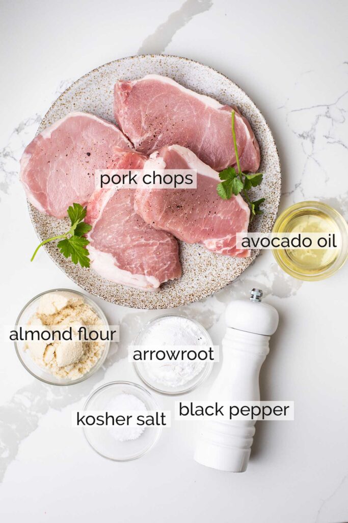 The ingredients needed to lightly coat pork chops in almond flour.